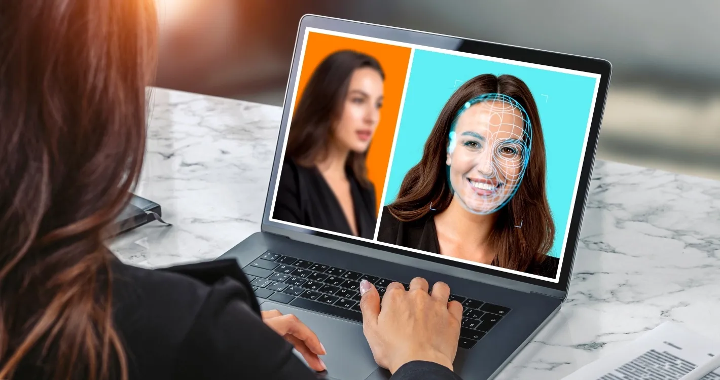 Woman browsing her laptop, detecting possible deepfake frauds