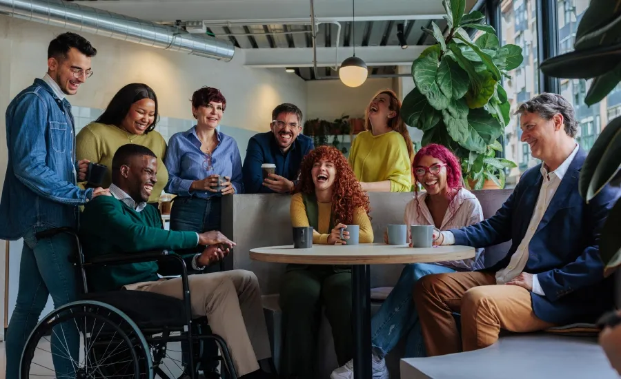 Diverse team collaborating together in the workplace.