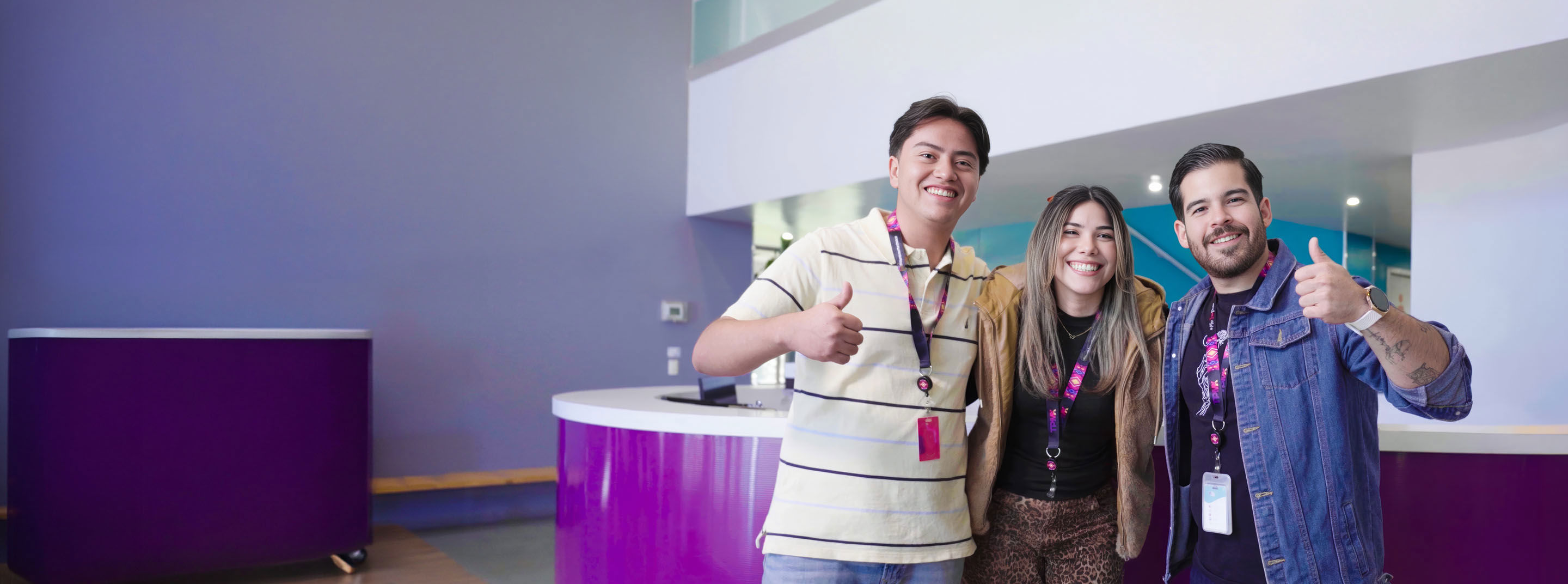 Happy colleagues sharing a positive moment in TP's workplace.