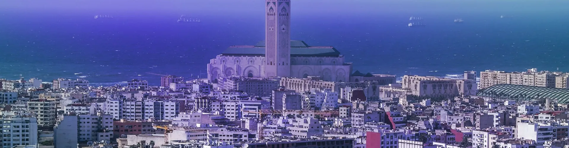 Casablanca skyline with the Hassan II Mosque overlooking the Atlantic Ocean.