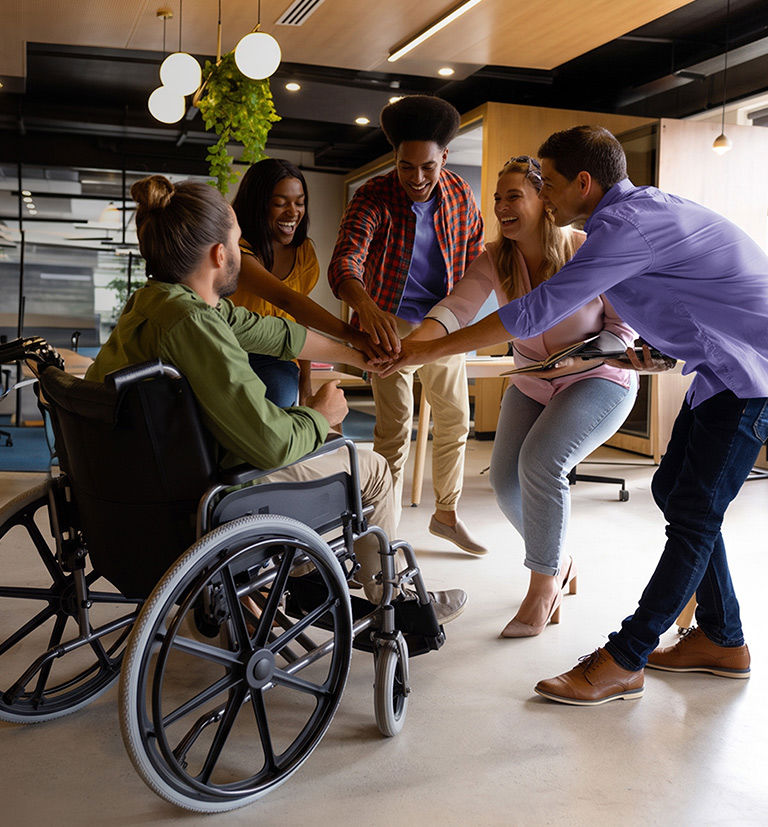 Diverse TP employees collaborating in an inclusive workplace.
