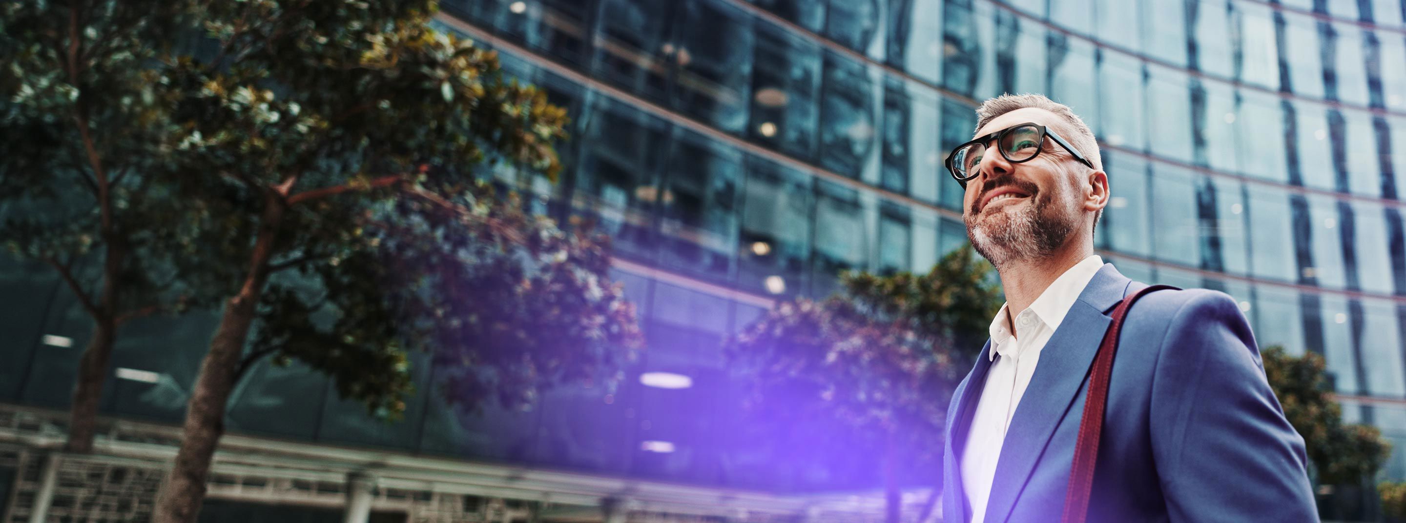 Business professional walking with an upright posture and a smile.