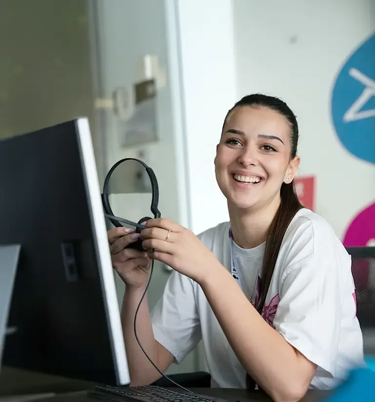 Smiling TP professional enjoying a supportive workplace that empowers women.