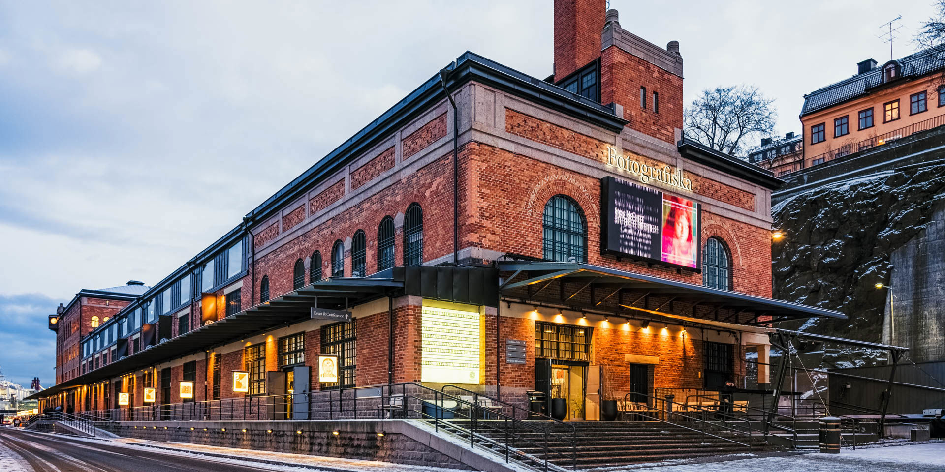 Brick office building exterior in an urban environment.