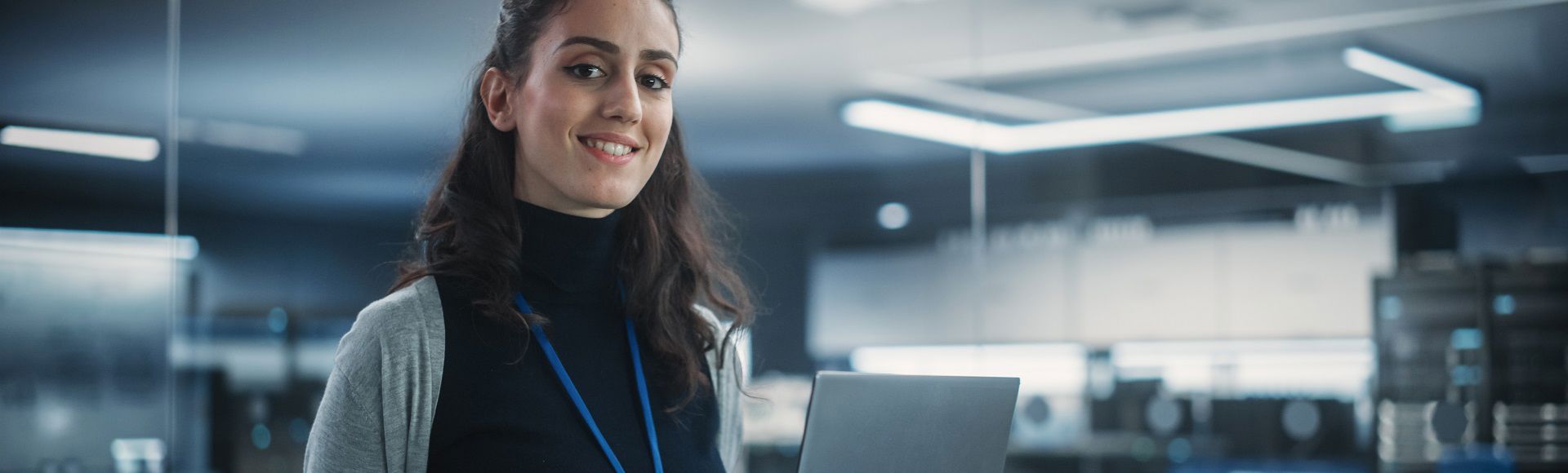 A woman smiling in a server room