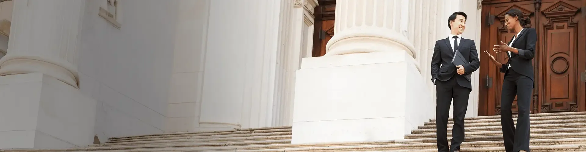Business couple walking down the stairs