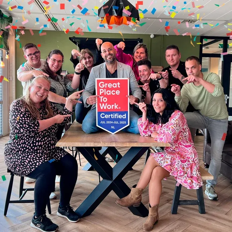 Happy Dutch TP employees celebrating GPOTW award recognition.
