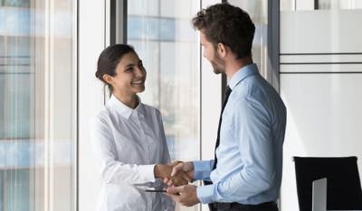 Businessmen shaking hands to close a deal