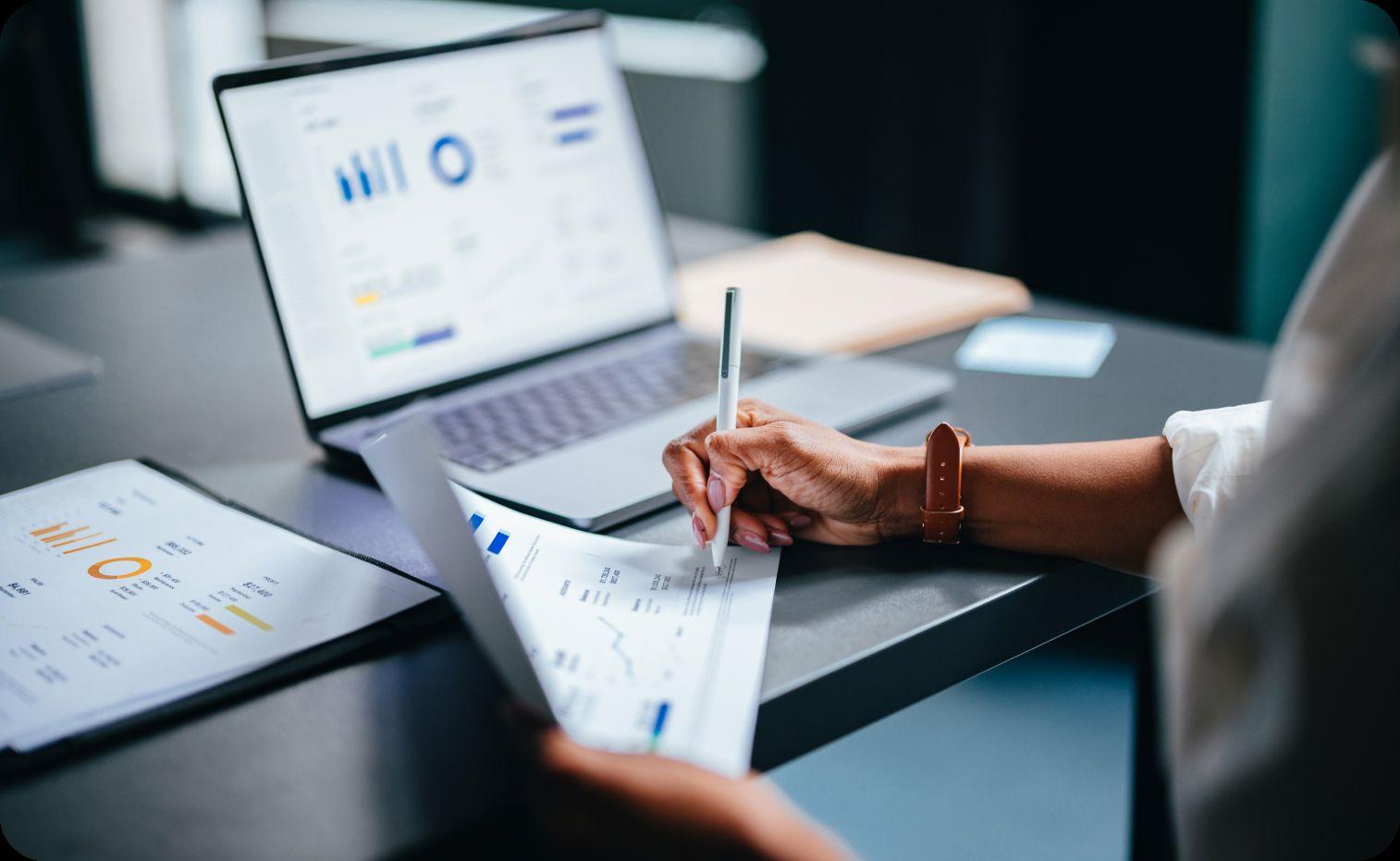 Professional analyzing charts on screen, illustrating advanced analytics.