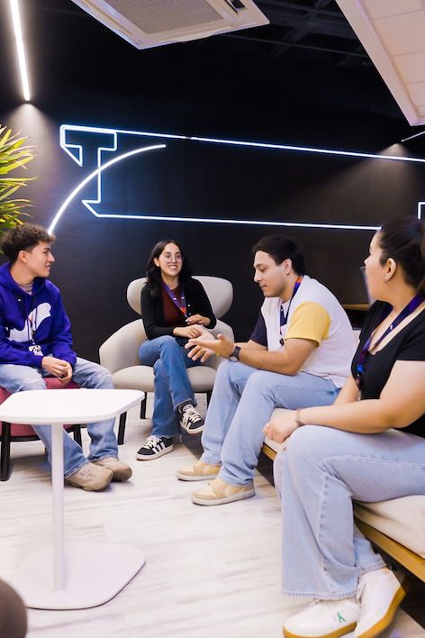 Customer service agents collaborating in a TP contact center environment.