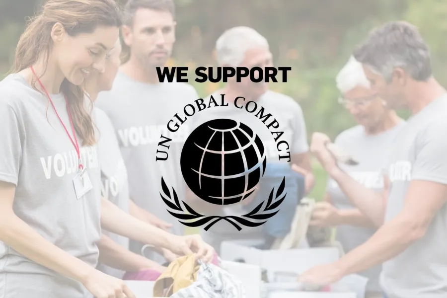 Group of people showing solidarity with the UN Global Compact, supported by TP.