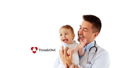 Smiling doctor holding smiling baby