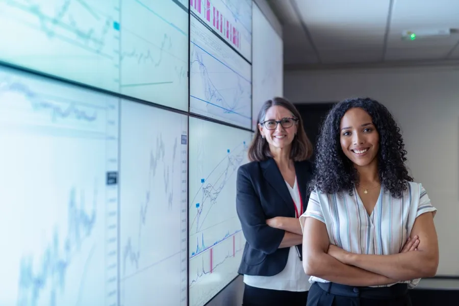 Women in data science working to protect customer data and digital security.
