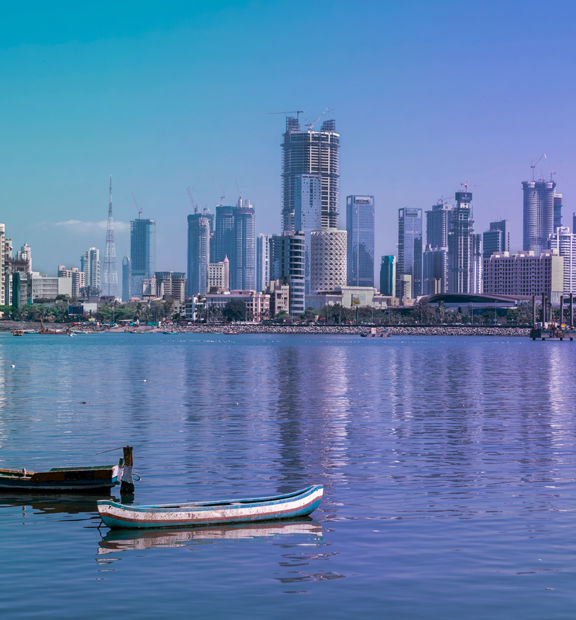 Mumbai skyline with high-rise buildings along the waterfront.