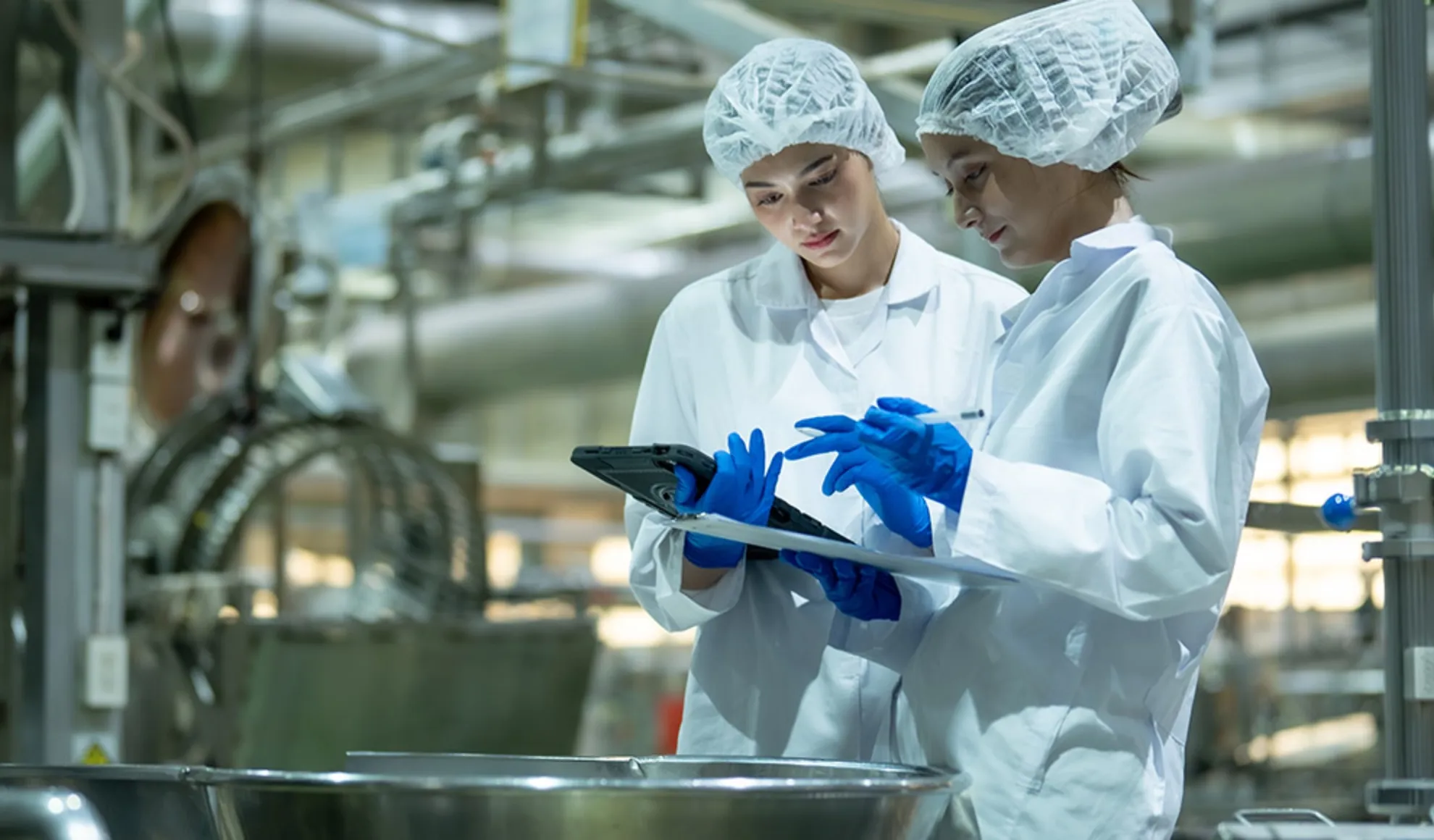 Two professionals ensuring product quality or a global food and beverage company.