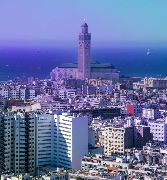 Casablanca skyline with the Hassan II Mosque overlooking the Atlantic Ocean.