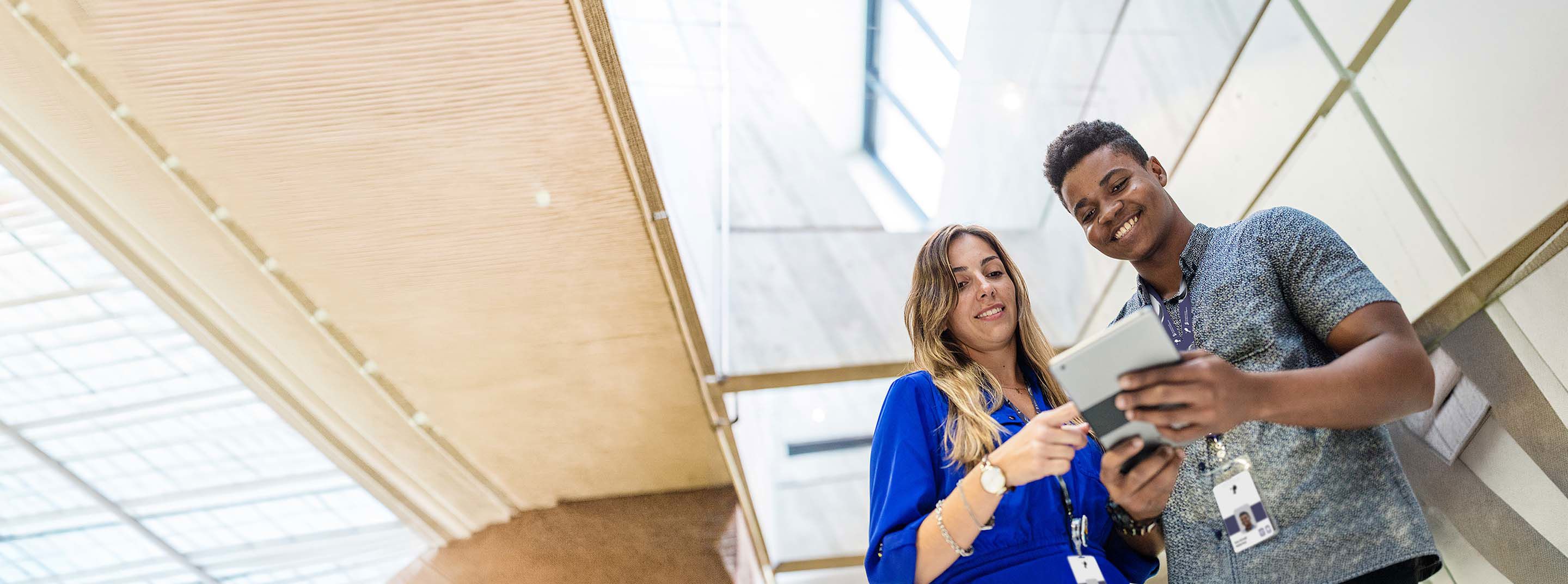 TP colleagues checking information on a smartphone during a work break.