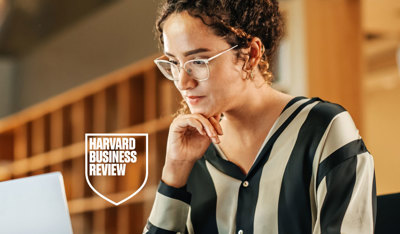 Highly-focused woman reading on a library 