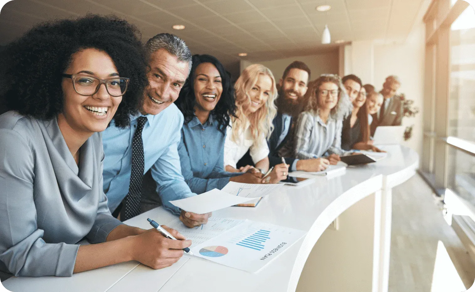 Diverse smiling group of employees in a row