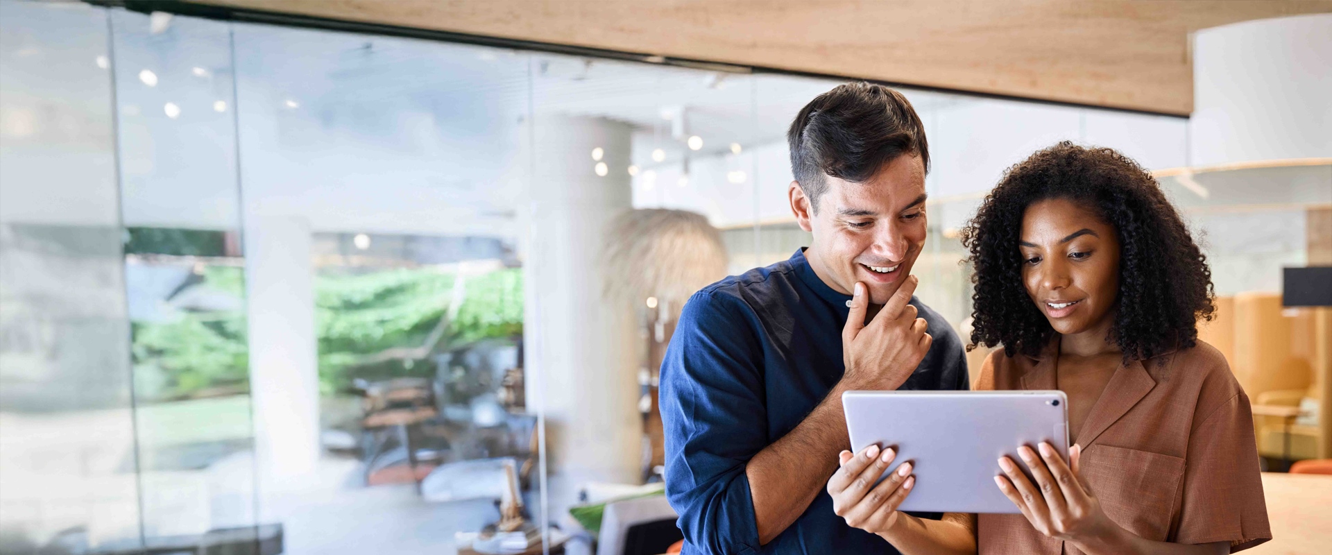Couple working on a tablet at the office