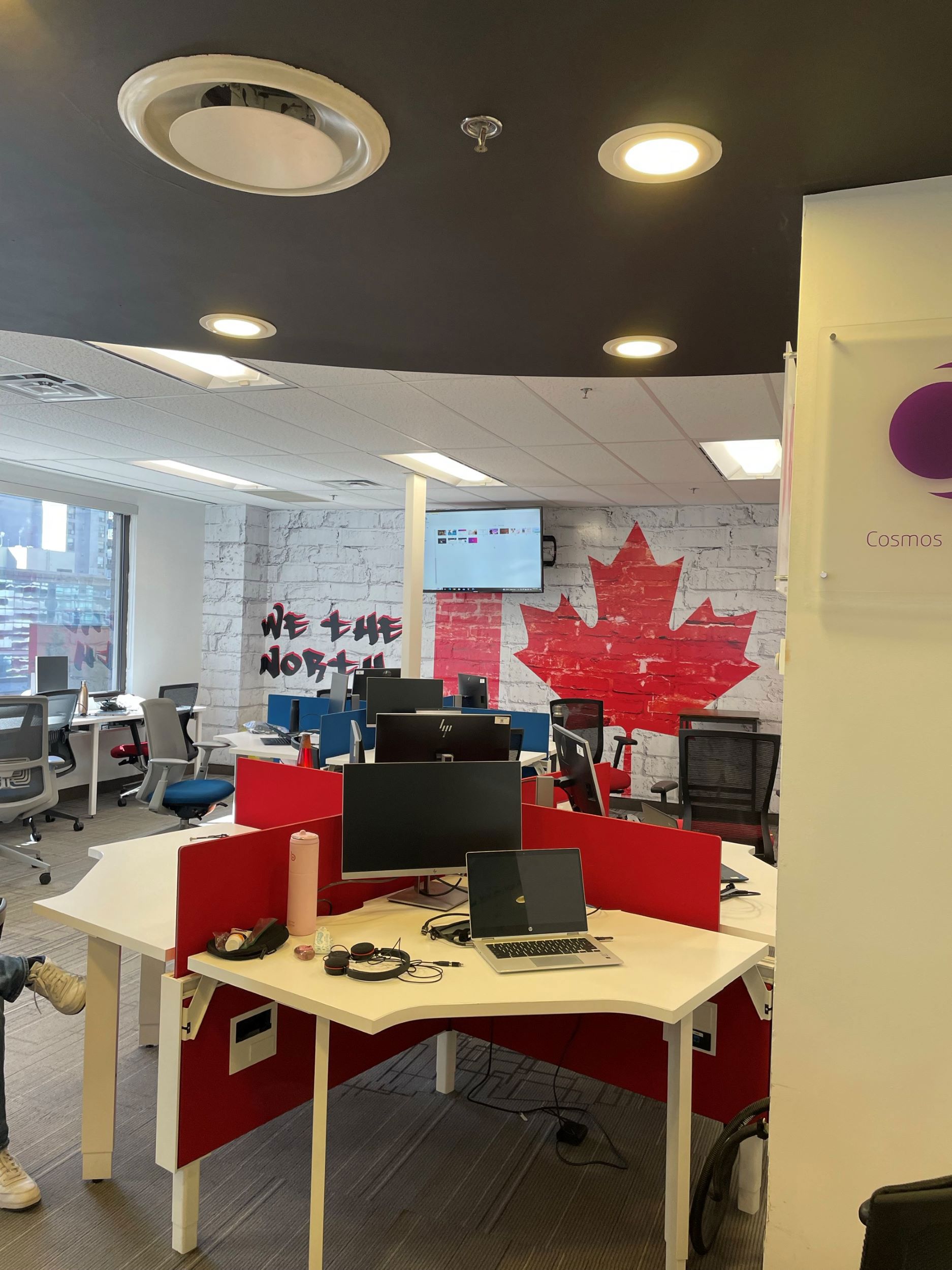 TP Canada team celebrating “We the North” initiative with branded signage.