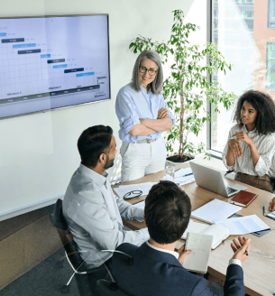 Group of employees having a meeting to discuss team strategies