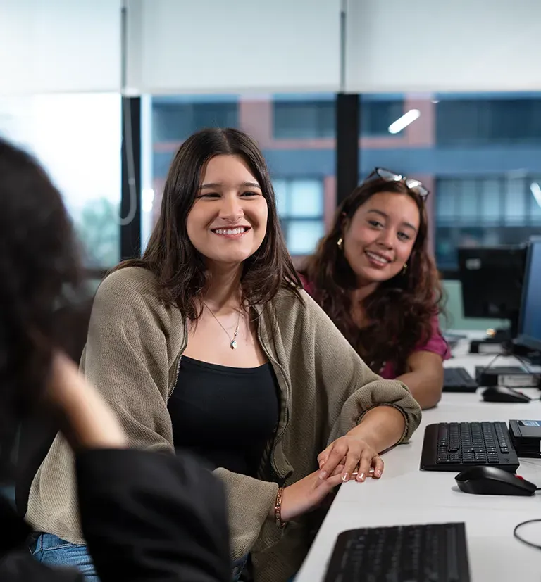 Young TP employees collaborating in a business operations environment.