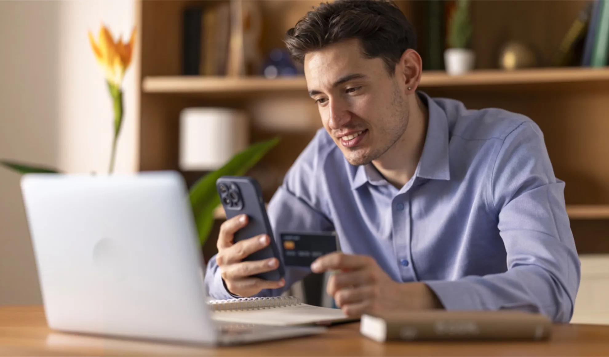 Young man using digital banking services for a seamless customer experience.