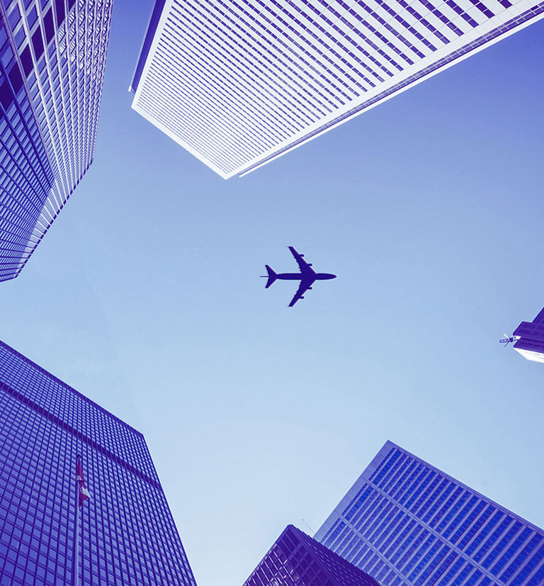 Airplane flying over the city.