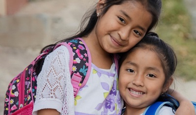 Young girls hugging each other