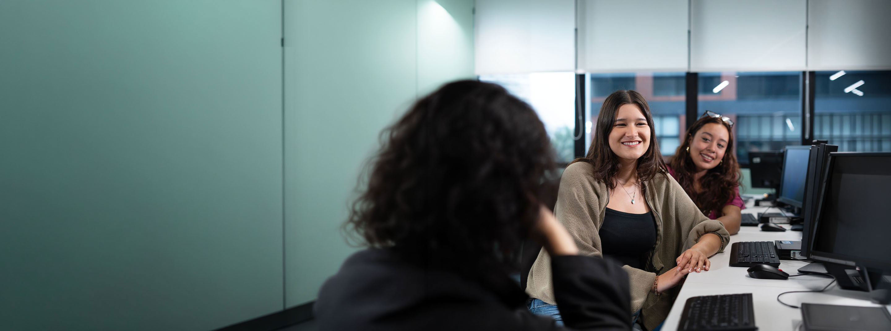 Young TP employees collaborating in a business operations environment.