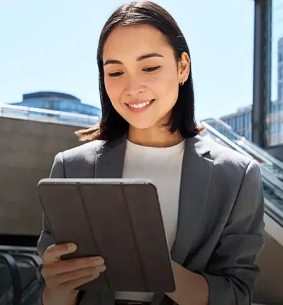 Women looking ata a tablet.
