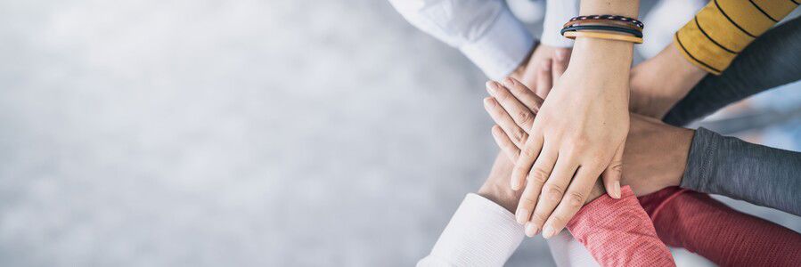 Hands stacked together