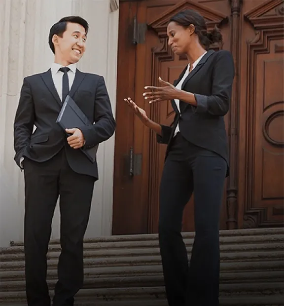 Business couple walking down the stairs