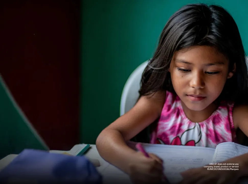 Young girl studying at school, representing TP’s partnership with UNICEF.