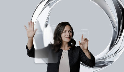 Woman interacting with a 3D chatbot panel through touch.