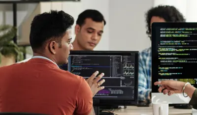 Software developers working on code for agentic AI development.