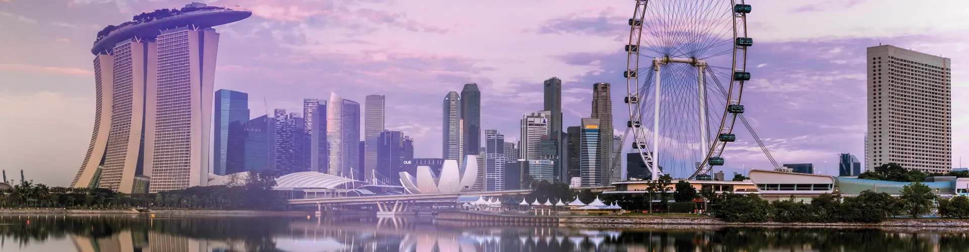 Singapore skyline with Marina Bay Sands, waterfront buildings, and the Singapore Flyer.