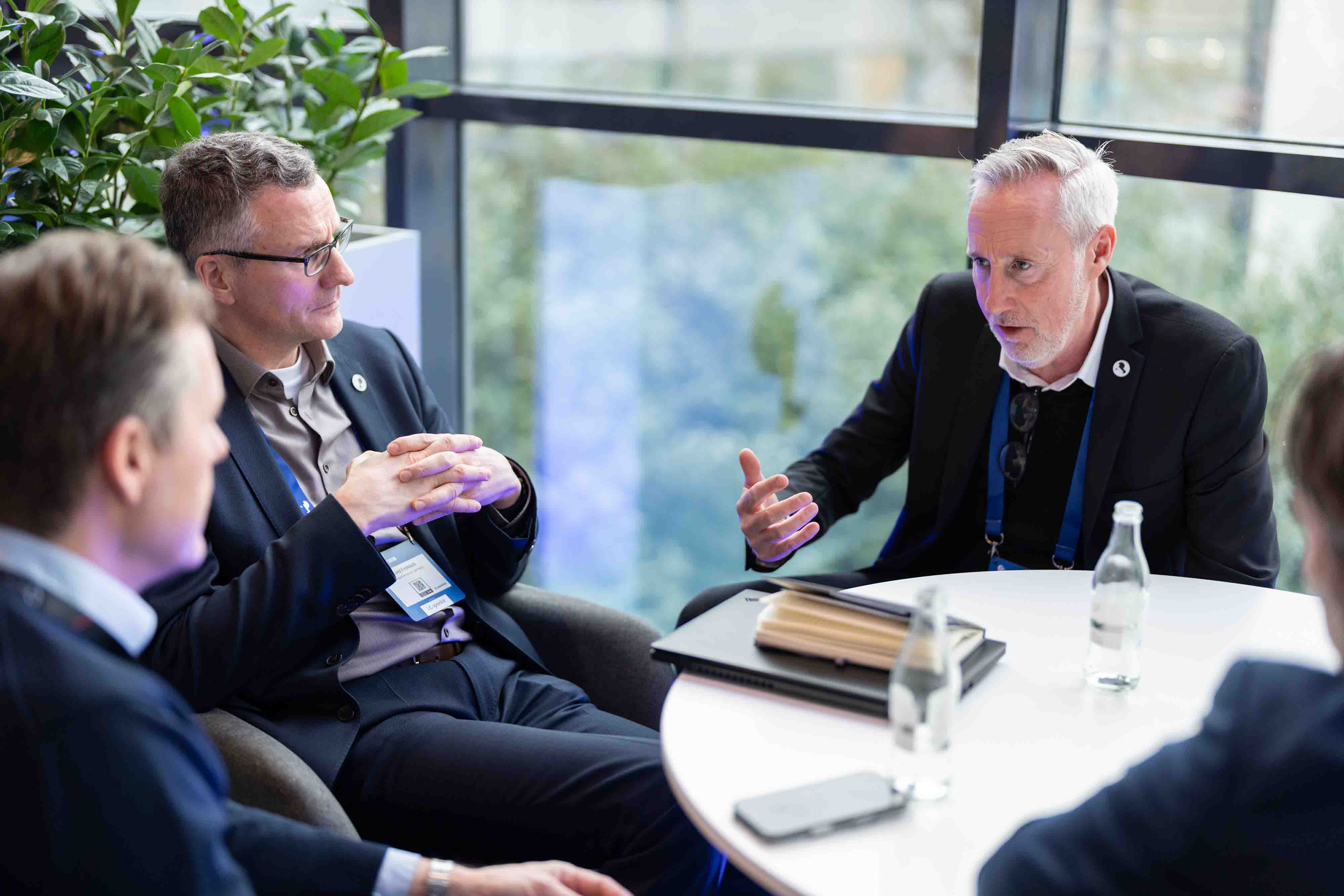 Business meeting taking place during a professional event.
