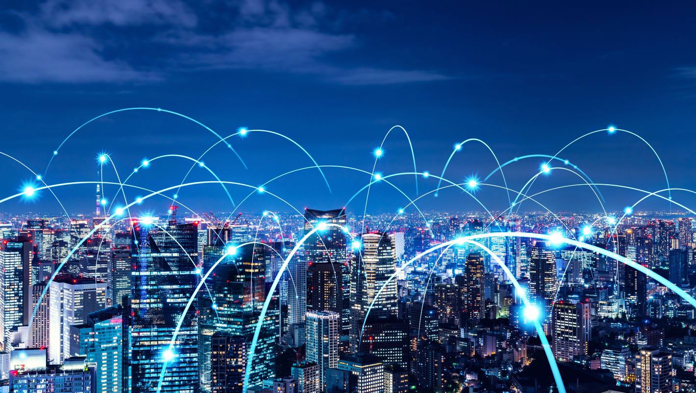 Digital connections across a city skyline illustrating TP’s global network and innovation.