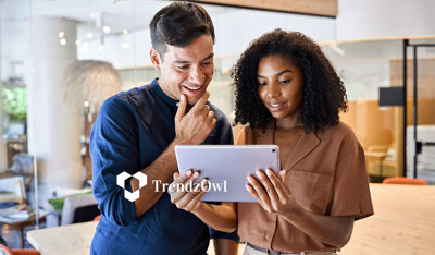 Office colleagues amazed while viewing a tablet, illustrating an insurance white paper.