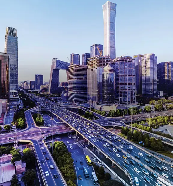 Beijing cityscape with modern skyscrapers and busy multilane roads.