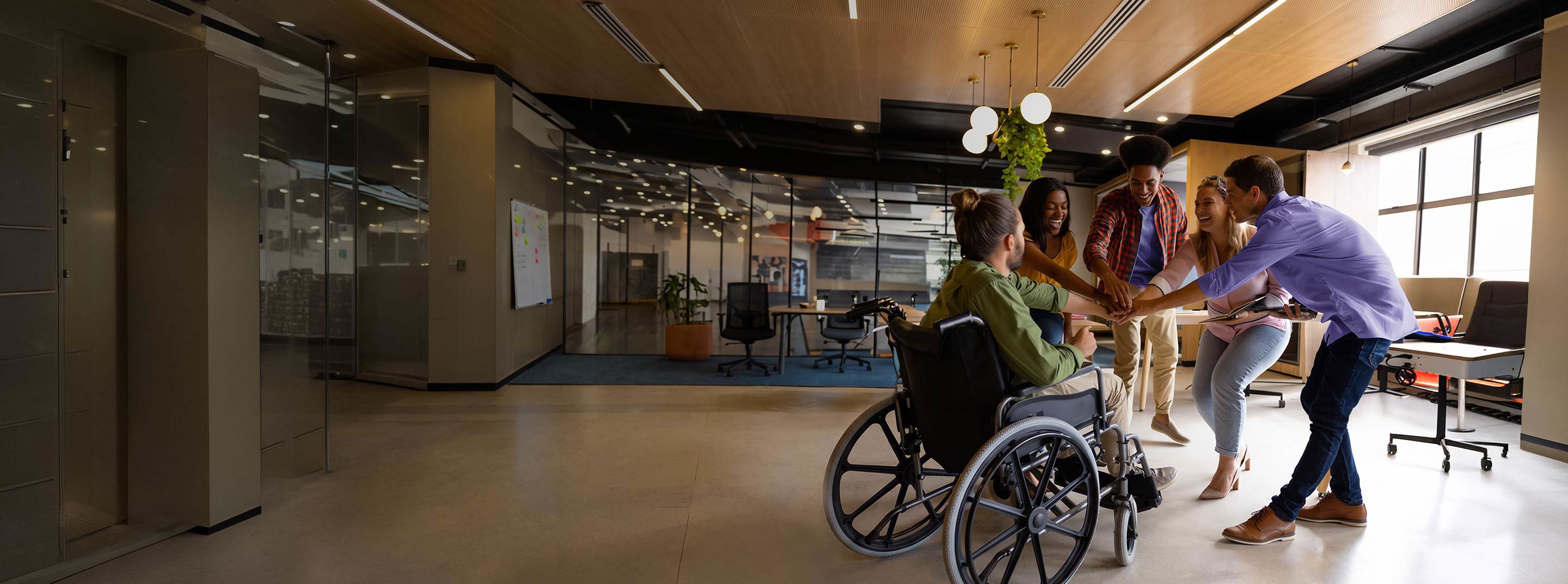 Diverse TP employees collaborating in an inclusive workplace.
