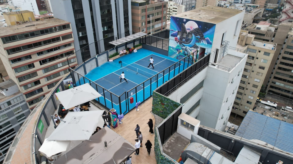 Colleagues enjoying time together on a rooftop activities.