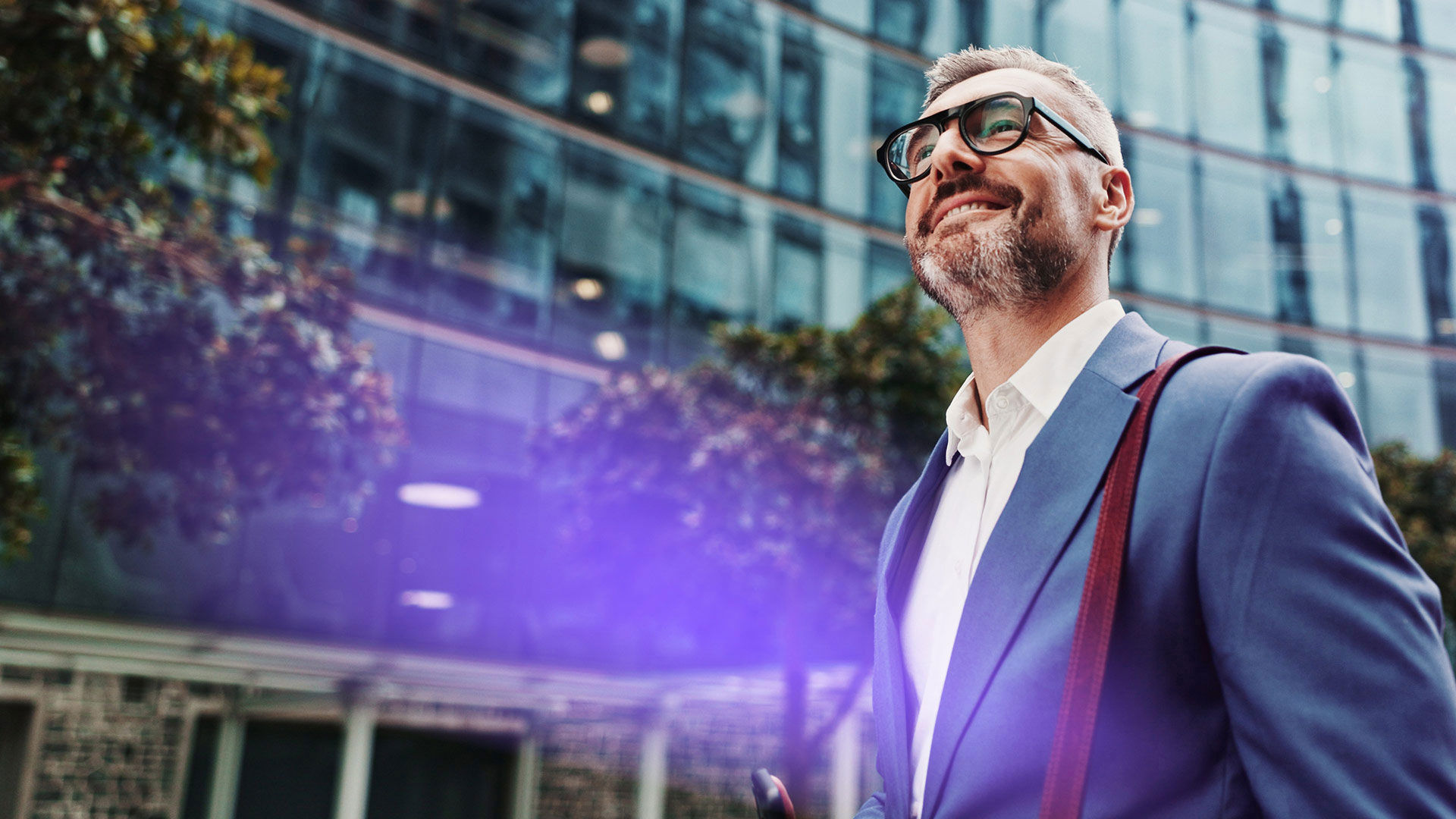 Business professional walking with an upright posture and a smile.