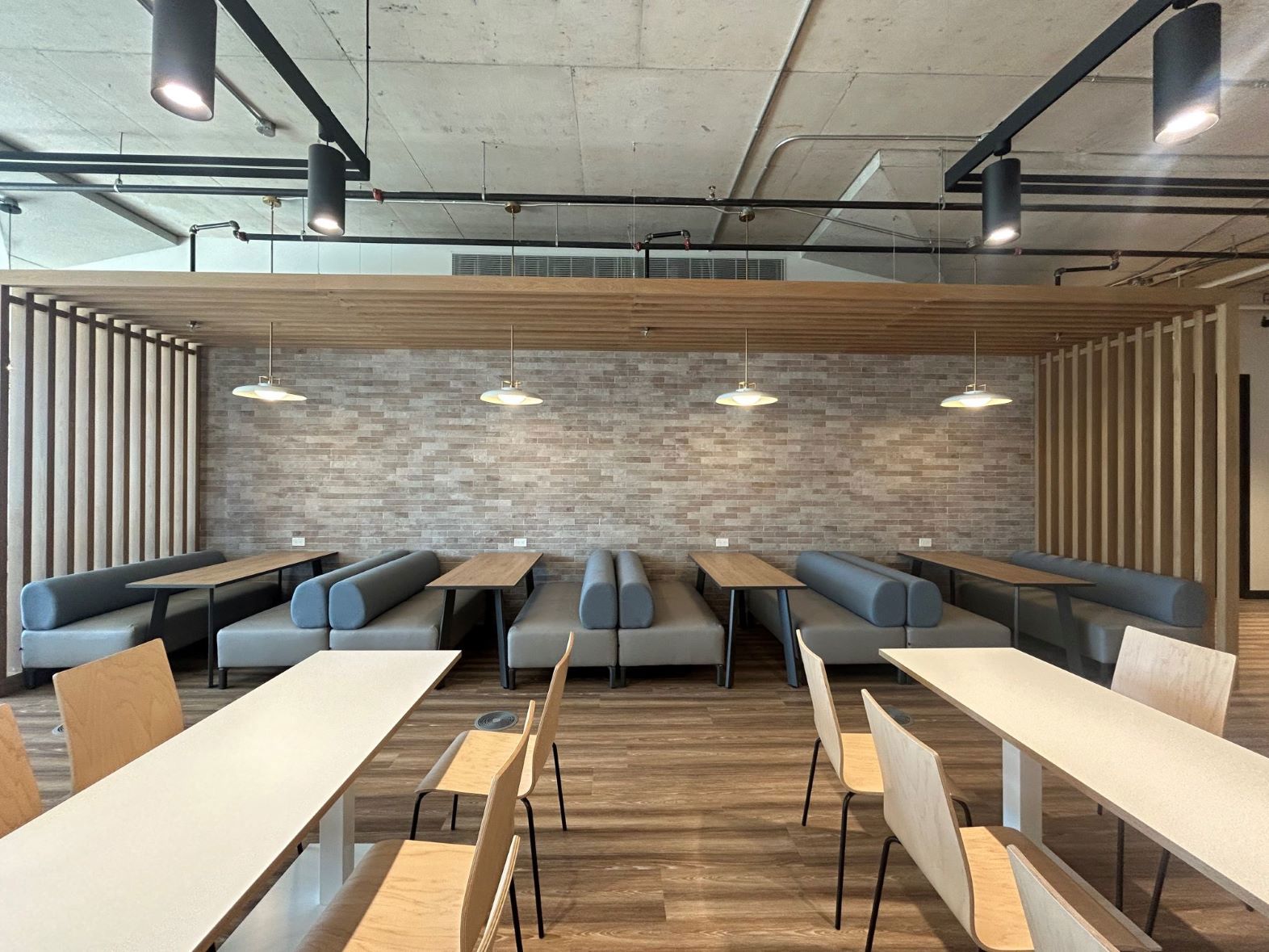 TP office area with desks and chairs in a modern workspace.