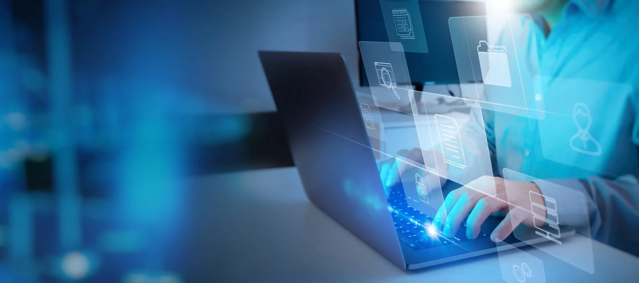 TP employee using a laptop with digital icons representing data and security.