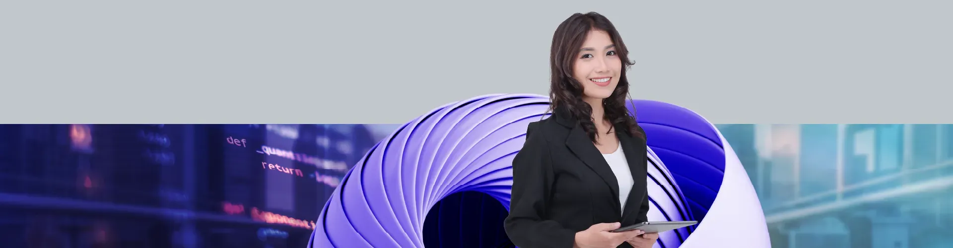 A confident female professional in a black blazer holds a tablet, smiling against a modern urban backdrop