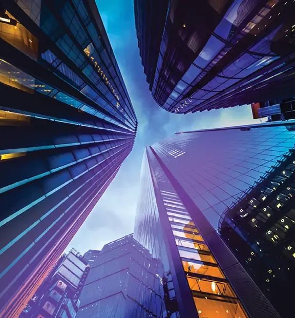 Modern city skyscrapers viewed from below against a blue sky