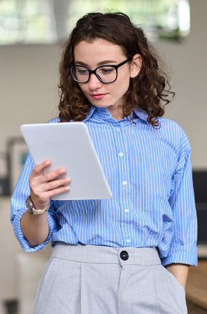 Young business woman reading on her tablet.